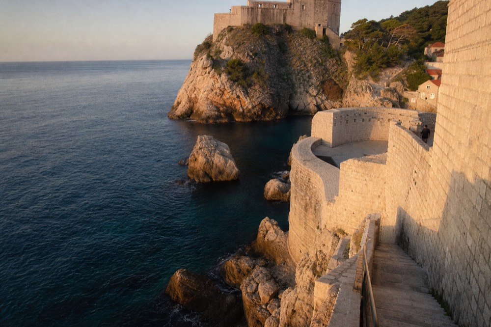 Calm blue sea against pale limestone rocks near Dubrovnik