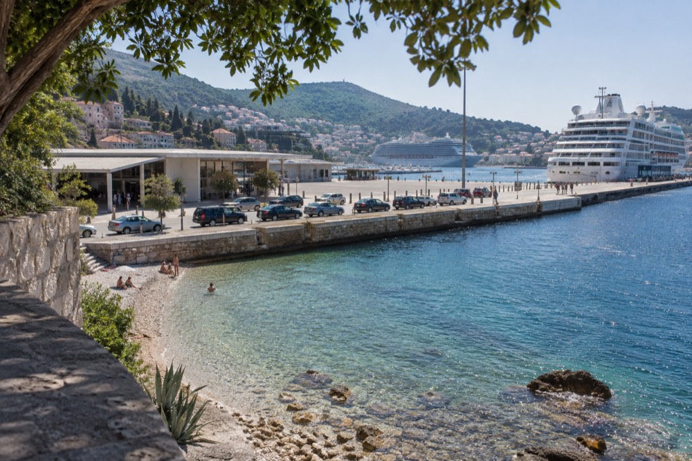 A row of taxis waiting at the curb outside the Dubrovnik cruise terminal
