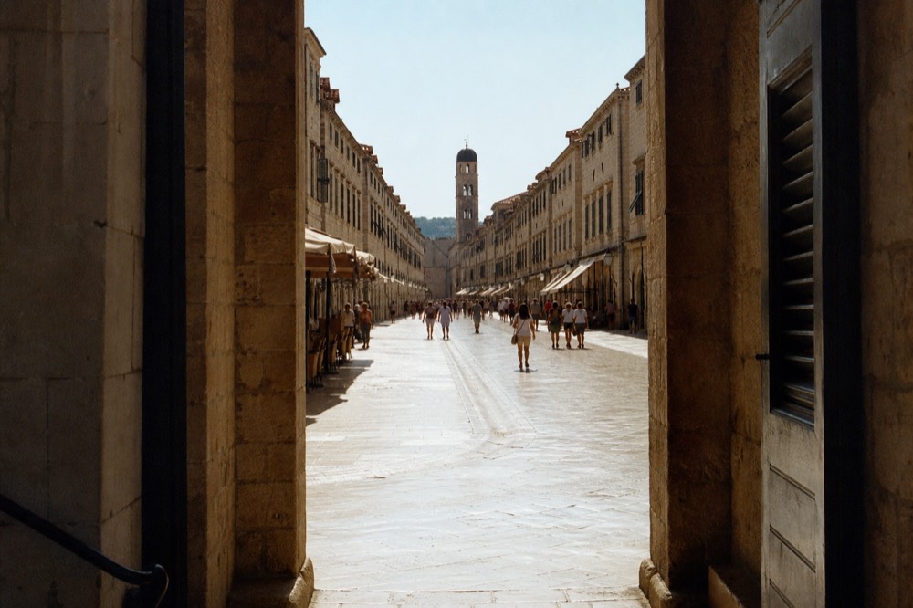 The limestone Stradun street stretching through Dubrovnik Old Town toward the clock tower