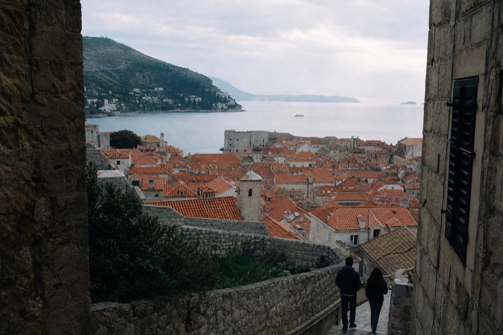 Wide view of Dubrovnik Old Town rooftops and the Adriatic Sea from the city walls
