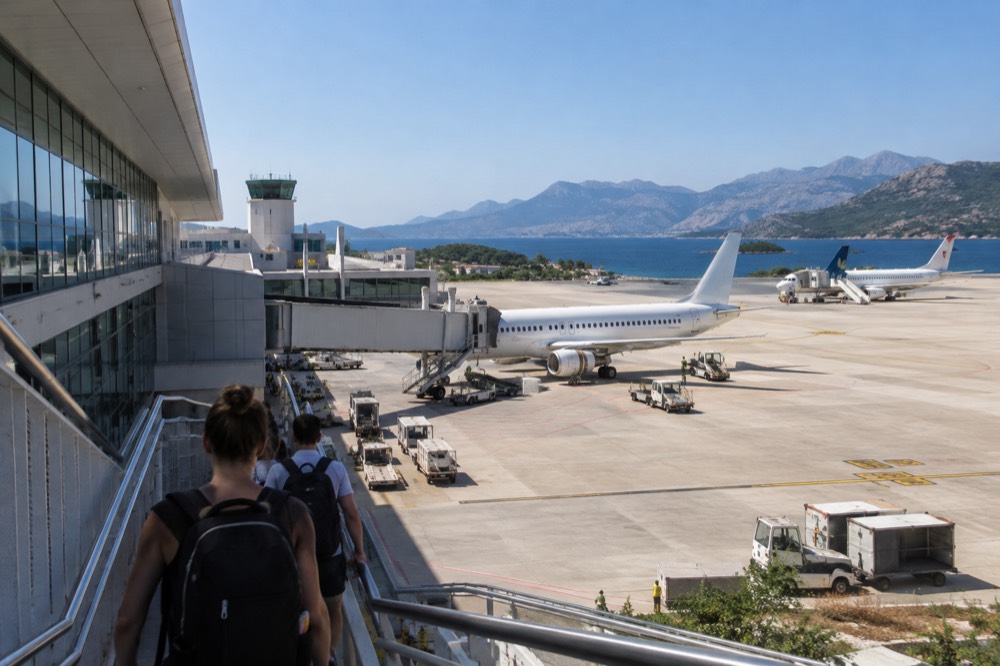 Dubrovnik Airport terminal with parked aircraft under a clear sky