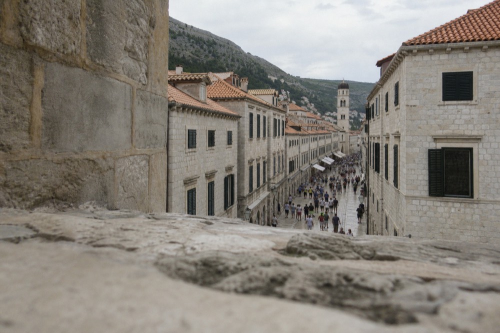 The Stradun from Pile Gate with the limestone street and crowds of people
