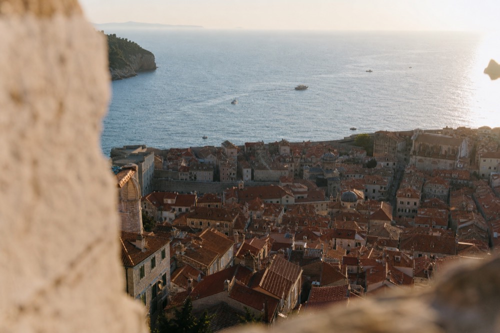 Wide view of Dubrovnik Old Town rooftops with the Adriatic Sea behind