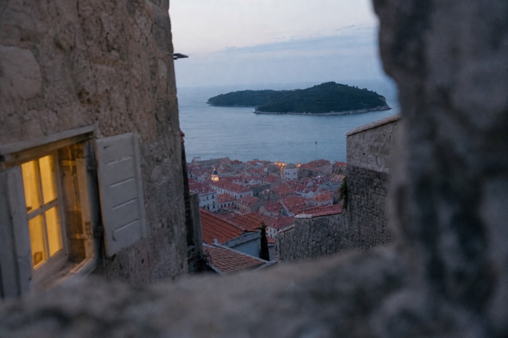 Red rooftops of the Old Town with the green island of Lokrum beyond