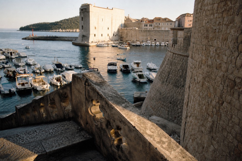 Harbour boats moored along the old city port of Dubrovnik