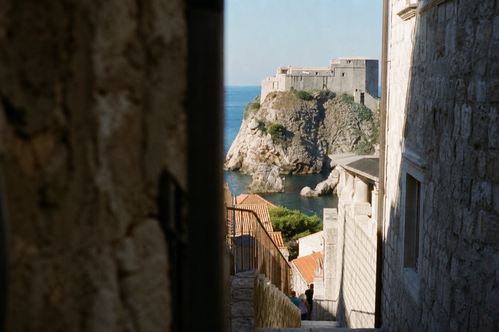 Fort Lovrijenac standing on its sea rock above calm blue water