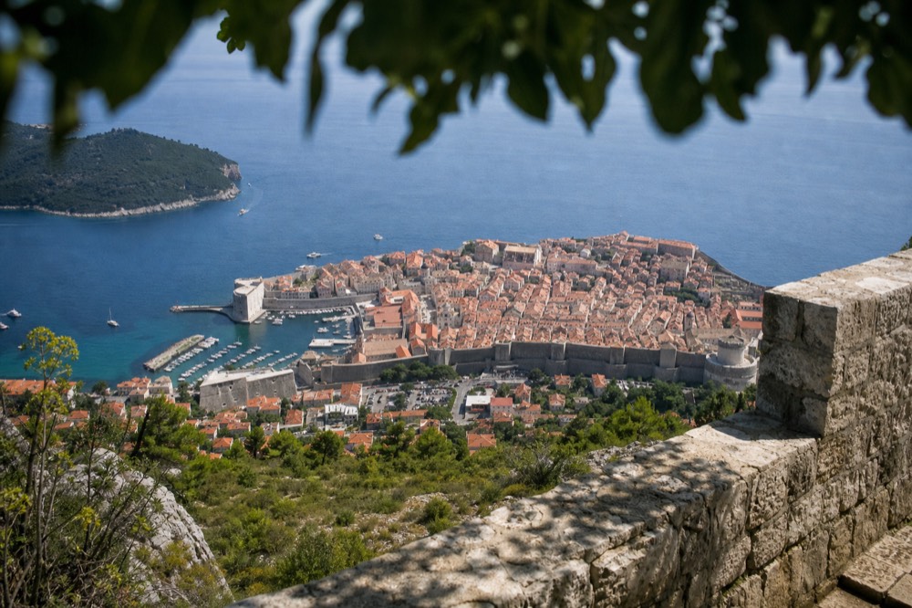 The walled Old Town of Dubrovnik seen from Mount Srd with the Adriatic Sea and Lokrum Island behind