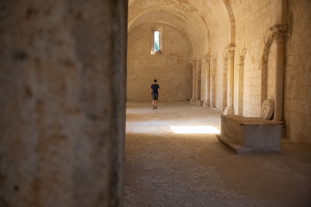 A vaulted stone hall on Lokrum Island, light falling from a high window onto the floor