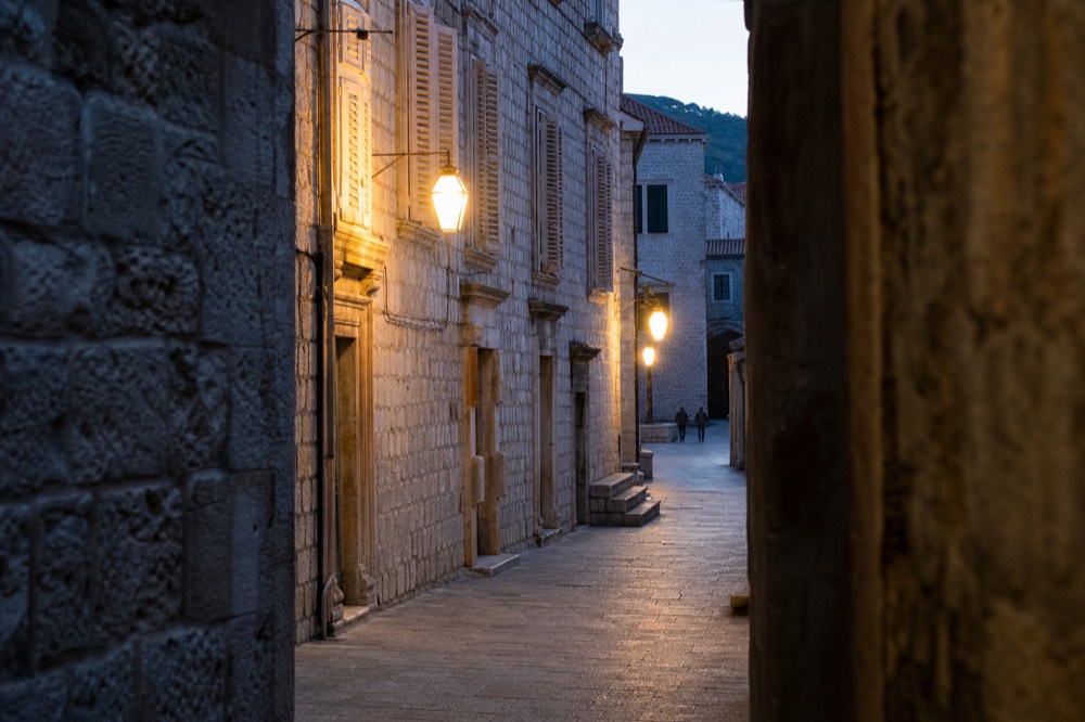 An empty limestone street in Dubrovnik Old Town in early morning light