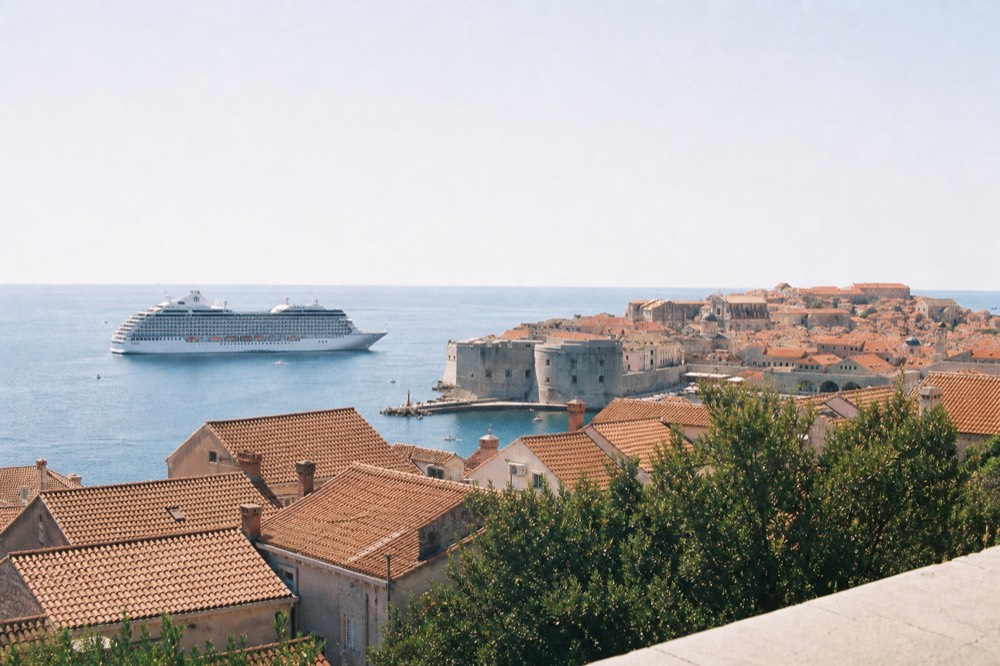 Cruise ship anchored off Dubrovnik Old Town seen from above