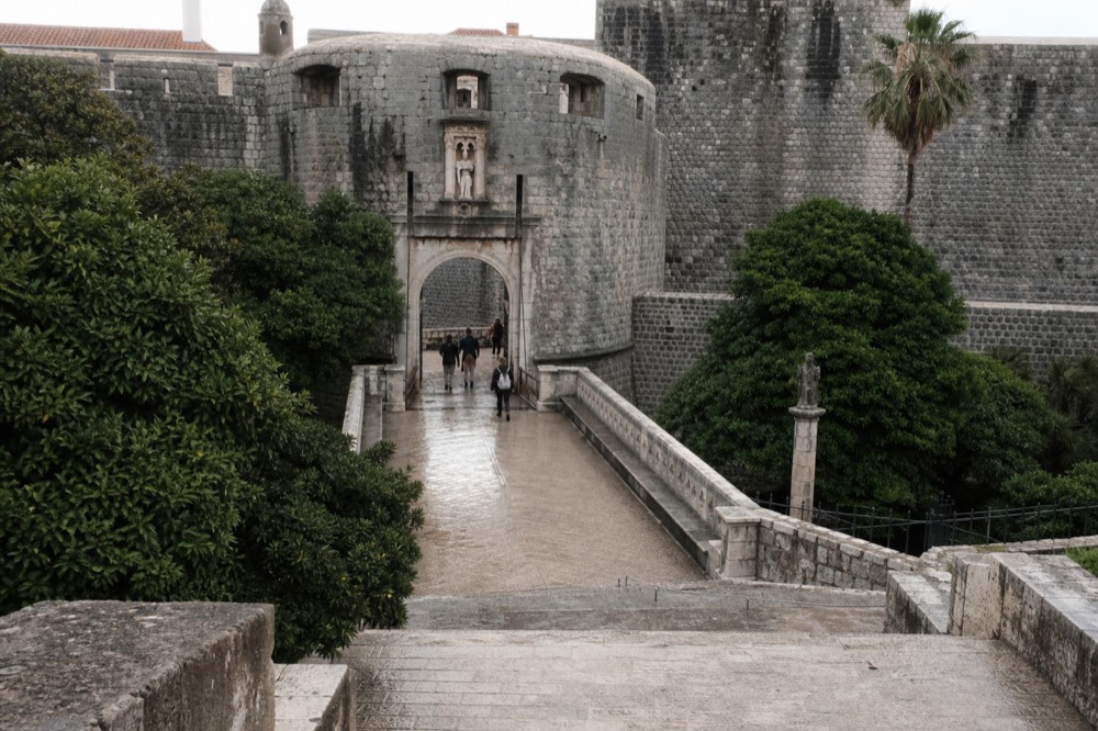 The Pile Gate entrance to the Old Town, with a stone bridge and the statue of St. Blaise above the arch