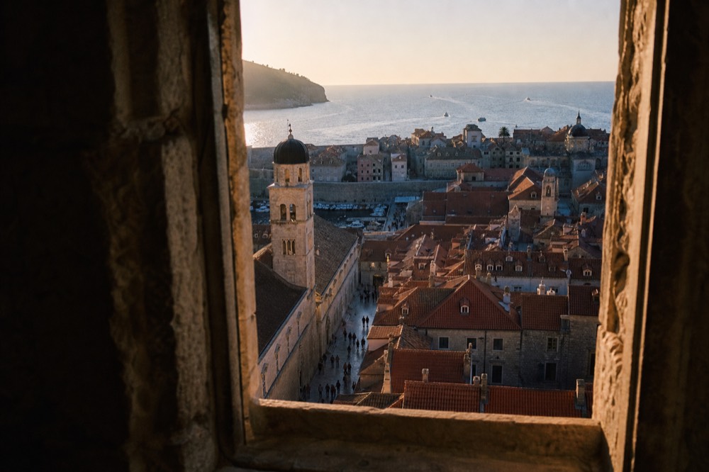 A view from the city walls looking down onto the red rooftops and the Stradun below