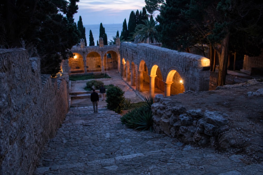 Stone cloister arcade of the ruined monastery on Lokrum