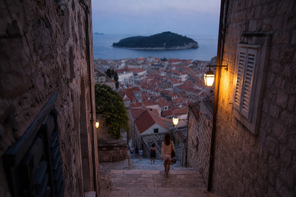 Red rooftops of Dubrovnik old town with the Adriatic sea and islands behind