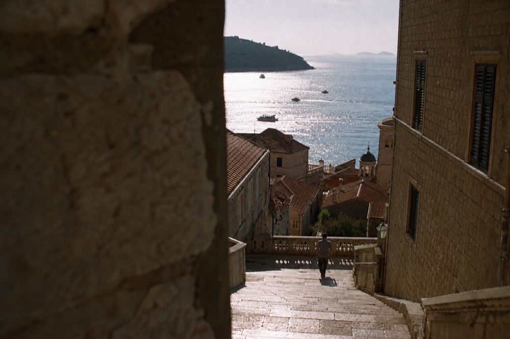 Baroque staircase between tall stone buildings in Dubrovnik Old Town