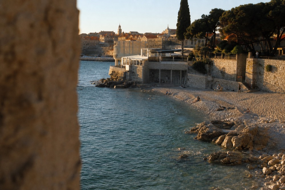 Sunset light on terracotta rooftops and church towers of Dubrovnik