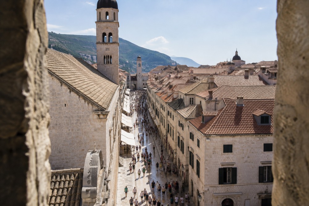 The Stradun filled with visitors in late morning sunshine