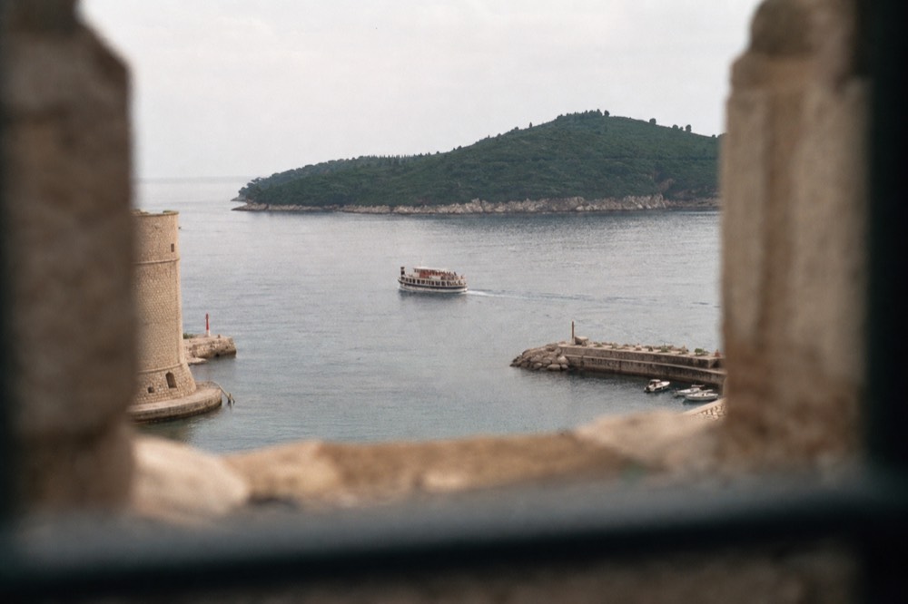Boat leaving the Old City Port toward the green island of Lokrum