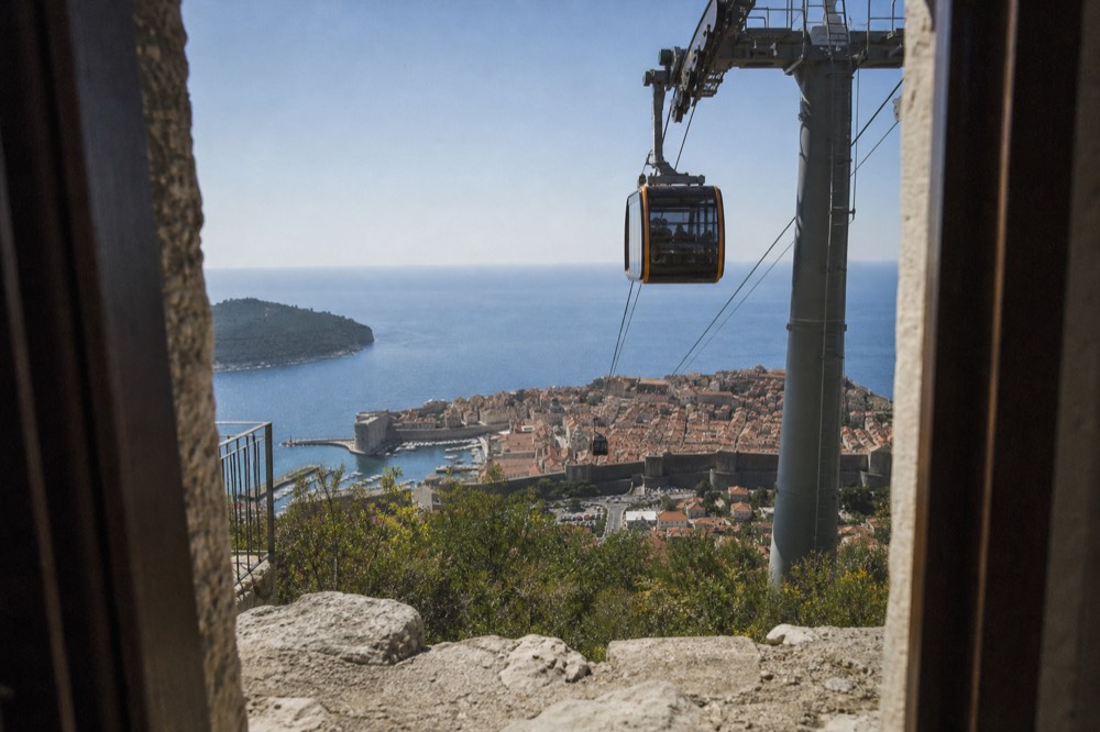 The Dubrovnik cable car cabins above the Old Town and the Adriatic